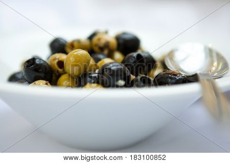 Green And Black Olives In Porcelain Plate