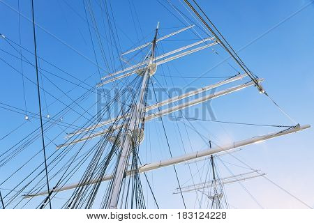 Ship masts in glowing highlights