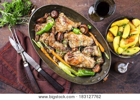 Rabbit with Vegetable and Mushrooms as top view in a Stewpot 