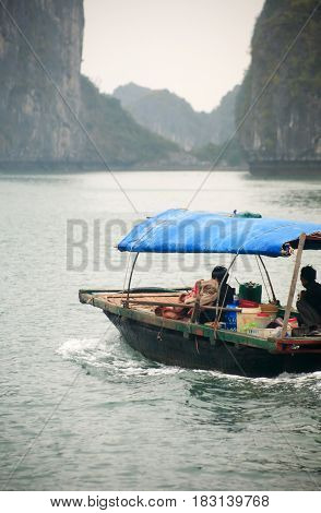 Halong Bay Vietnam - March 7 2017: fishingl boat near Cat Ba island Halong Bay Vietnam