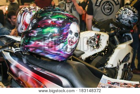 St. Petersburg Russia - 15 April, Exclusive drawings on moto helmets,15 April, 2017.
International Motor Show IMIS-2017 in Expoforurum.
Visitors and participants of the annual moto-salon in St. Petersburg.