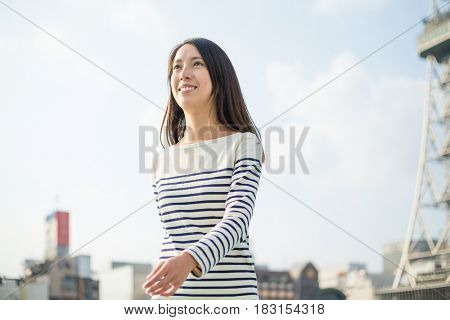 Woman walking in japanese city