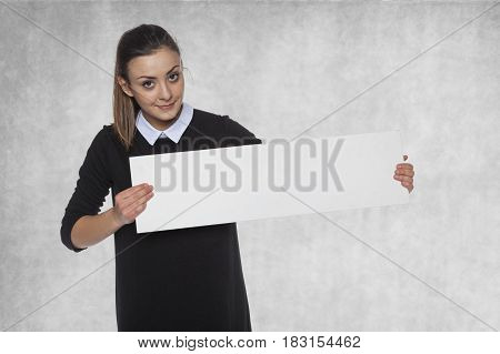 Smiling Fashion Woman Holding A Blank Billboard, Space For A Link