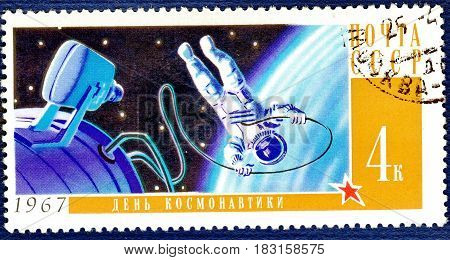 USSR - CIRCA 1967: Postage stamp printed in USSR shows Soviet cosmonaut in open space, with an inscription 