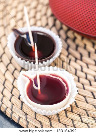 Ginja de Obidos traditional sour cherry liquor served in small cups made of chocolate.