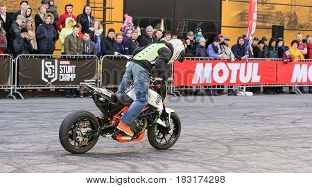 St. Petersburg Russia - 15 April, The biker rides along the spectators,15 April, 2017.
International Motor Show IMIS-2017 in Expoforurum.
Sports motorcycle show of bikers on the open area.