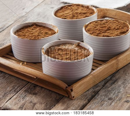 Creamy rice pudding with cinnamon. A simple, nutritious dessert made from rice, milk, eggs, vanilla and sugar.