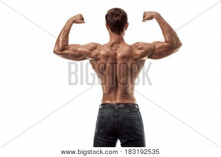 Strong Athletic Man Fitness Model posing back muscles, triceps over white background. Copy space. Isolated on white background.