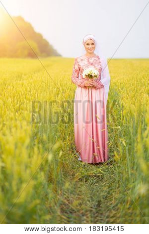 Muslim Bride Posing At A Celebration Ceremony.