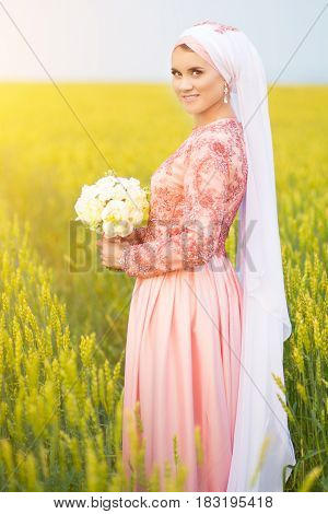 Muslim Bride Posing At A Celebration Ceremony.