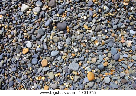 Kiesel auf dem Strand vom Ozean geglättet