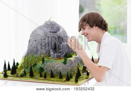 School Student Working On Model Building Project