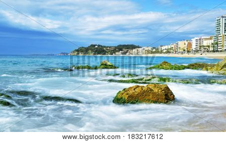 a view of the seafront of Lloret de Mar and the main beach of this popular tourist village in the Costa Brava, in Catalonia, Spain