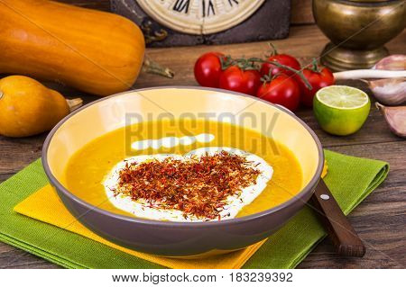 Thick vegetable soup with yoghurt and saffron. Studio Photo