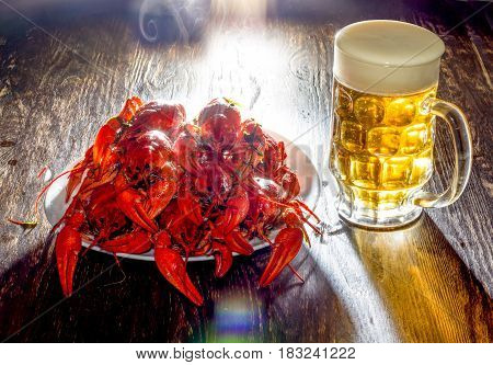 Plate With Boiled Crawfish And A Glass Of Beer