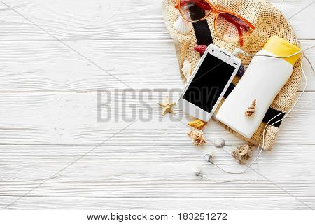 Summer Vacation Concept Flat Lay. Hat Phone With Empty Screen, Headphones Sunscreen Sunglasses And S
