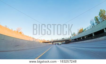 POV point of view -Driving South in Interstate highway I25 at sunset.