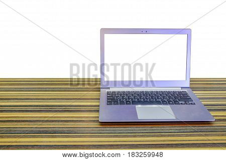 Laptop with blank screen on long table with isolated on white background