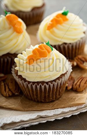 Carrot cupcakes with cream cheese frosting and decoration