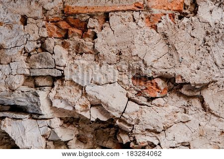 Red old worn collapsed brick wall texture background