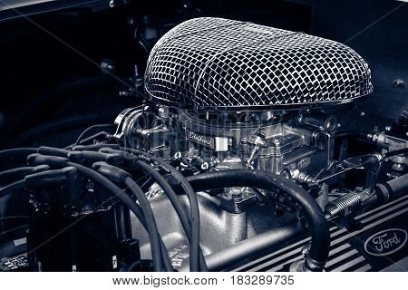 BERLIN - JUNE 14 2015: Engine of a roadster Shelby AC Cobra 427 1966. Toning. Stylization. The Classic Days on Kurfuerstendamm.