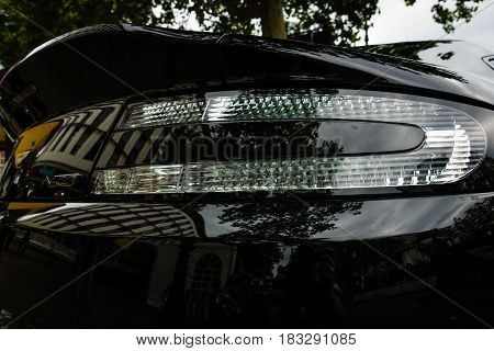BERLIN - JUNE 14 2015: Stoplight of a luxury sports car Aston Martin V8 Vantage N430 (since 2015). The Classic Days on Kurfuerstendamm.