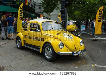 BERLIN - JUNE 14 2015: A compact car VW Beetle in the color ADAC (Allgemeiner Deutscher Automobil-Club eV). The Classic Days on Kurfuerstendamm.