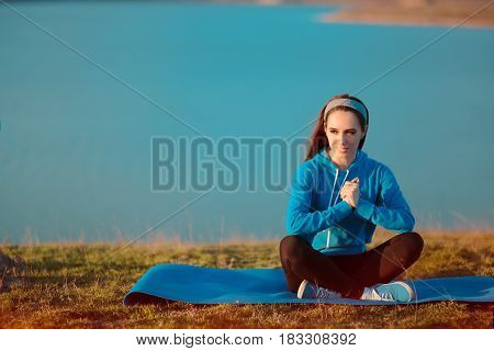 Girl Relaxing on Yoga Mat in Nature vy The Sea