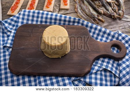 Still life - traditional Norwegian cuisine - Brunost and fish
