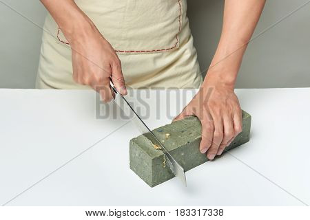 Man Cutting A Handmade Soap With A Knife