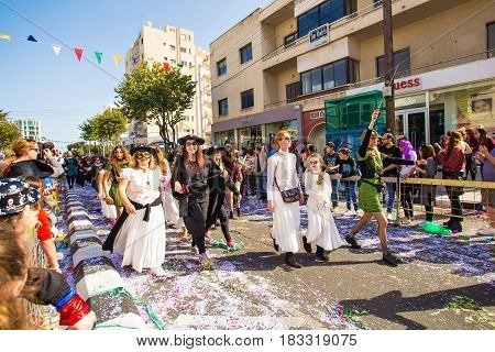 LIMASSOL, CYPRUS - FEBRUARY 26: Grand Carnival Parade - an unidentified people of all ages , gender and nationality in colorful costumes during the street carnival