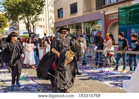 LIMASSOL, CYPRUS - FEBRUARY 26: Grand Carnival Parade - an unidentified people of all ages , gender and nationality in colorful costumes during the street carnival
