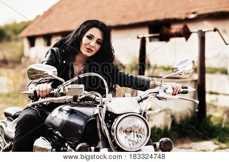 Beautiful Motorcycle Brunette Woman With A Classic Motorcycle (cinema Bleach Bypass Effect)