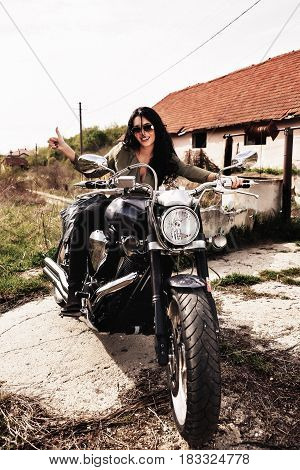Beautiful Motorcycle Brunette Woman With A Classic Motorcycle (cinema Bleach Bypass Effect)