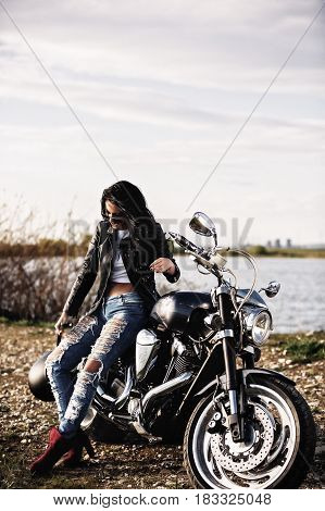 Beautiful Motorcycle Brunette Woman With A Classic Motorcycle (cinema Bleach Bypass Effect)