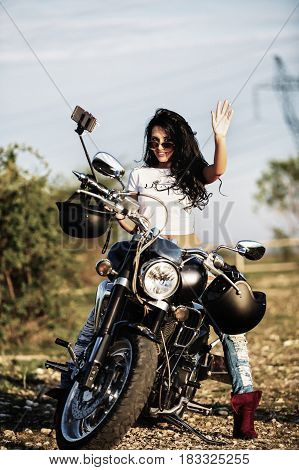 Beautiful Motorcycle Brunette Woman With A Classic Motorcycle (cinema Bleach Bypass Effect)