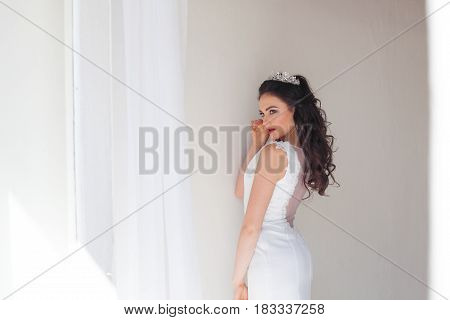 Portrait of bride wedding dress Crown curls hairstyle