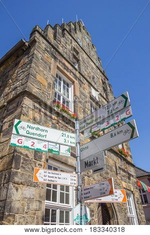 SCHUTTORF, GERMANY - JULY 19, 2016: Traffic sign for cyclists in front of the town hall of Schuttorf, Germany