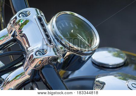 Chromed speedometer retro motorcycle close up. Transport