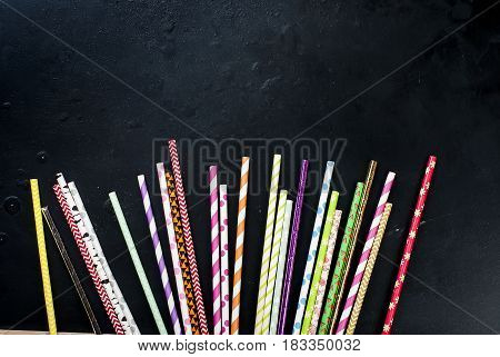 Cocktail Straw On A Black Background Top View