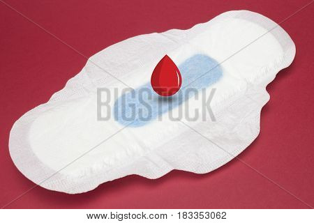 Menstruation sanitary soft pad for woman hygiene protection and digital drawn blood drop. Woman critical days gynecological menstruation cycle. Medical conception photo
