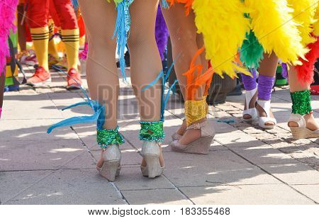 The beautiful legs of women dancers of the Pacific and caribbean beach