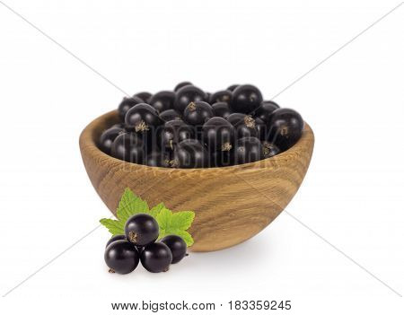 Bowl with blackcurrants isolated on white background. Ripe currants close-up. Background berry. Sweet and juicy berry with copy space for text. Antioxidant and the best berry a source of vitamin C