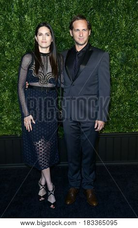 NEW YORK-APR 24: Josh Lucas (R) and Jessica Ciencin Henriquez attend the 12th Annual Tribeca Film Festival Artists Dinner hosted by Chanel at Balthazar Restaurant on April 24, 2017 in New York City.