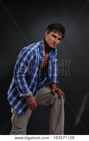 the handsome cowboy is taking a knee at the moment.