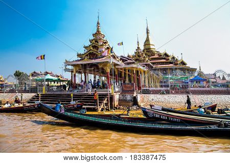 INLE, MYANMAR-MARCH 4, 2017:  Transportation by boat in front of Phaung Daw Oo Pagoda on March 4, 2017, Inle lake, Shan state, Myanmar. (Burma)