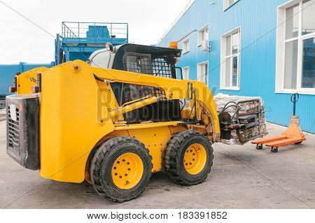 Forklift truck. Waste processing plant. Technological process. Recycling and storage of waste for further disposal. Business for sorting and processing of waste.
