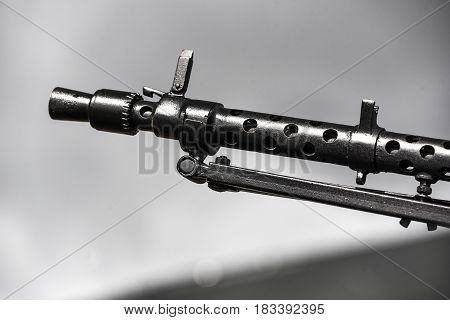 A rifle of machine gun of a white background.