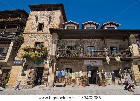Comillas Spain - April 19 2017: Souvenir Shop And Old Buildings In The Touristic Medieval Village Of