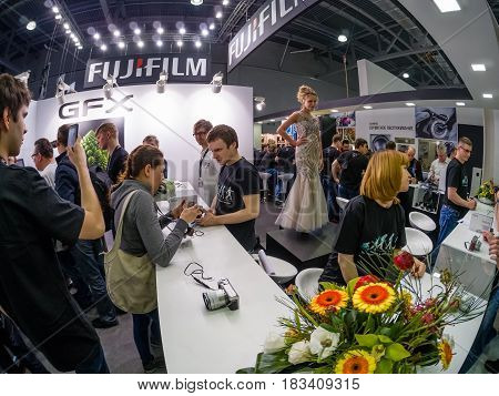 MOSCOW RUSSIA - APRIL 21 2017: Booth of Fujifilm company at PhotoForum 2017 trade show and exhibition in Moscow Russia on April 21 2017.